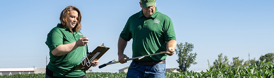 photo of a student and instructor in a field