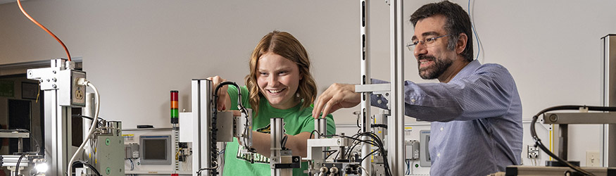 photo of a student and professor in a lab