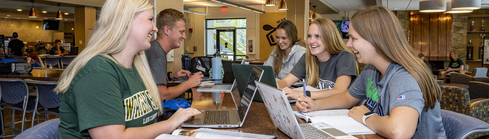 photo of students sitting at a table together at lake campus