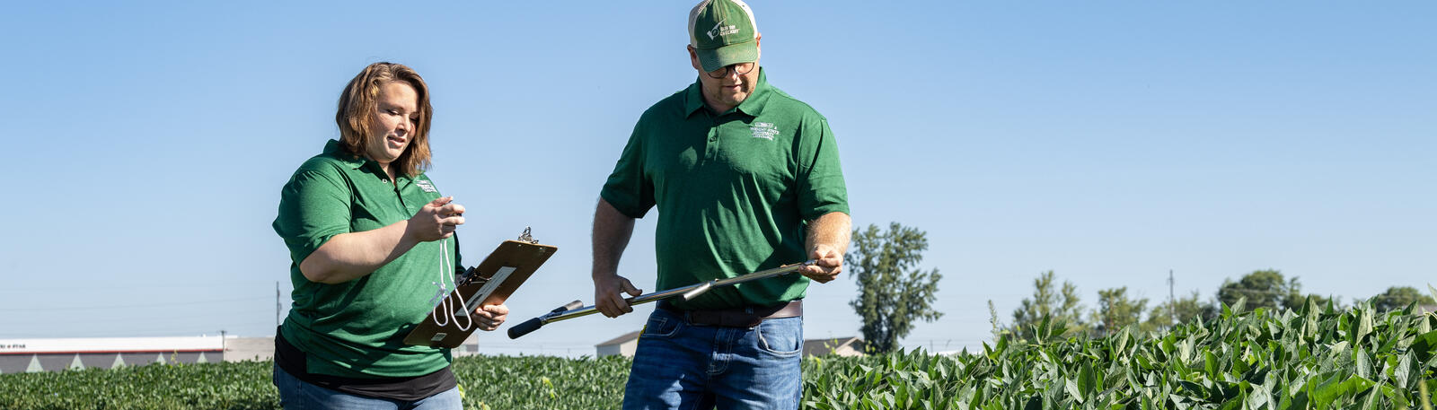 photo of an instructor and student in a corn field