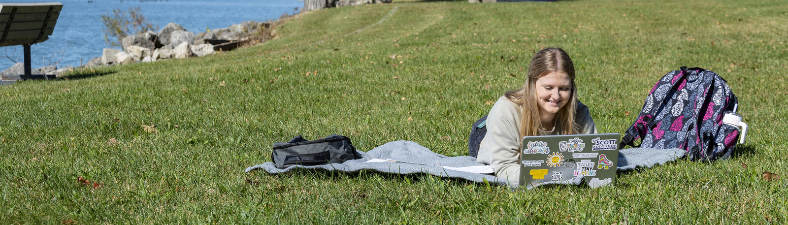photo of a student studying outside at lake campus